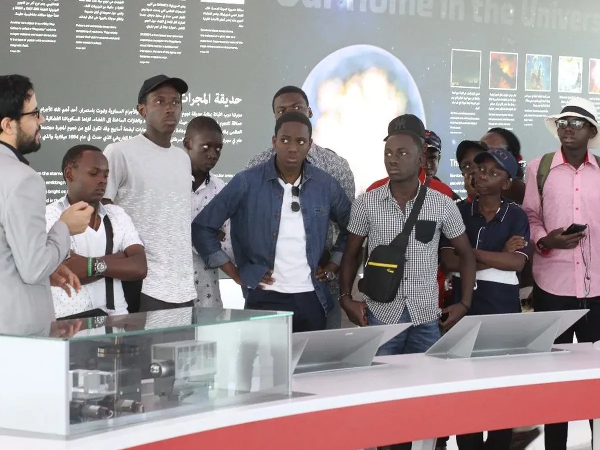Ugandan students engaged in a science learning experience